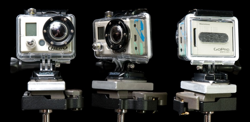 <center>My GoPro: decaled out, posing over a black background, and showing some character marks</center>